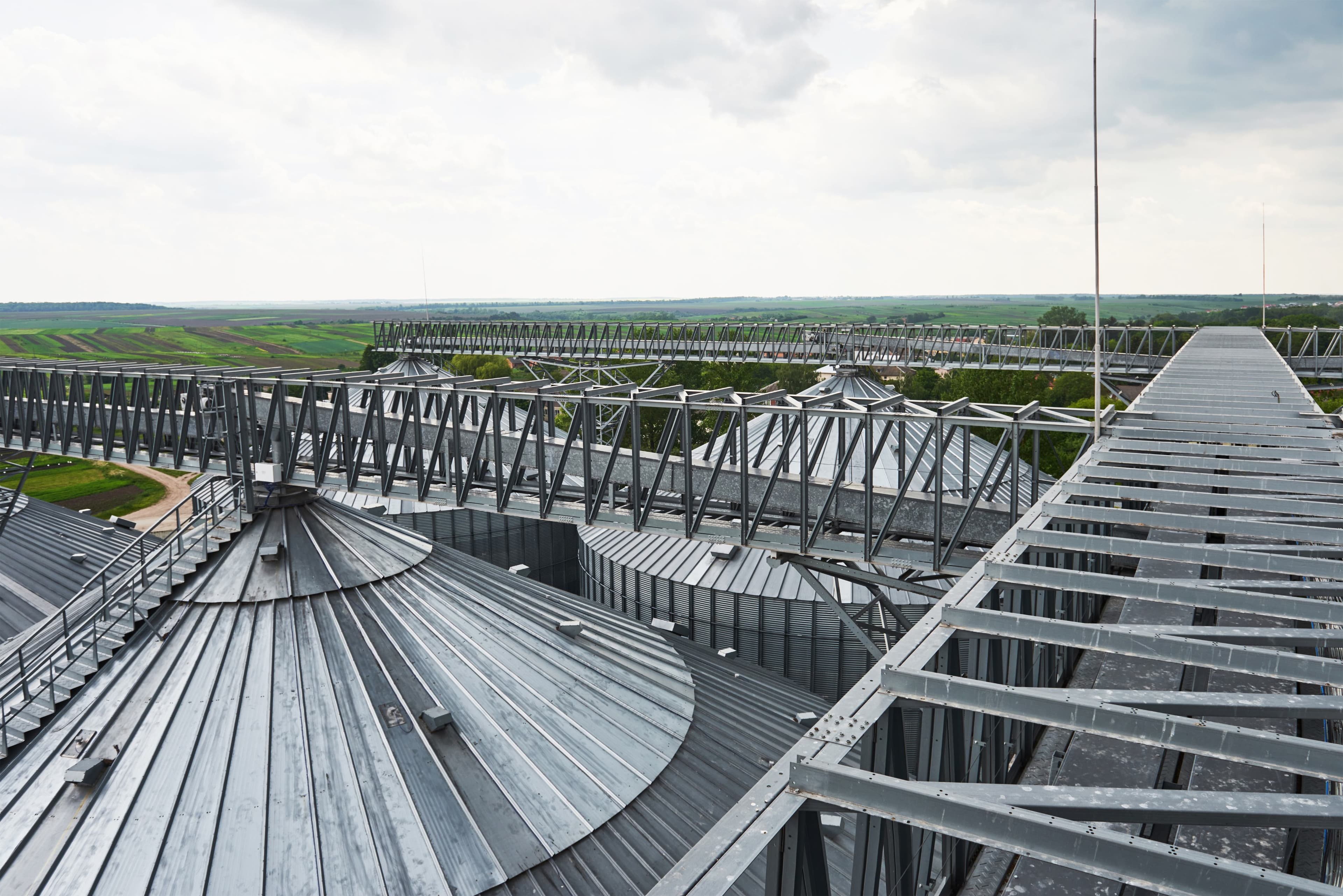 Elevated walkway across industrial storage infrastructure